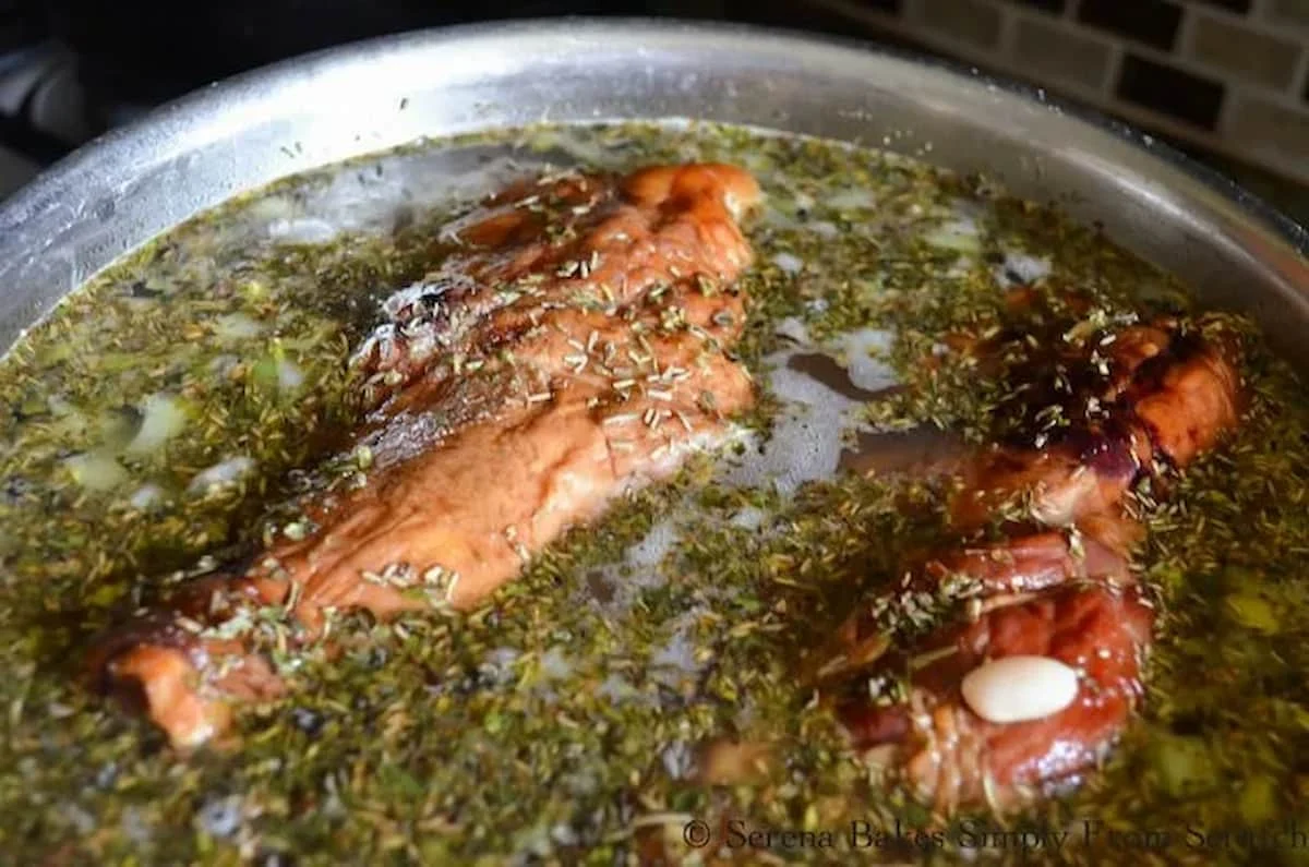 Ham Bones, Beans, and Herbs in a Stainless Steel Soup Pot.