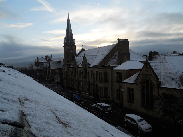 Snow,  North England, Newcastle Upon Tyne, Winters,  Snowman, Weather.This year Scotland and the North of England has received record breaking snowfall in the month of November. The last time it snowed this much was in 1985. More records seem to be next in line to be broken as the snow continues to fall. Luckily for me, I happened to be at the right place at the right time to witness this. Following pictures have been shot near our home in Newcastle-Upon-Tyne.This picture has been clicked from my skylight. This was the first day of snow. You can still see the black road below. However, this was just the beginning. You will see much more snow in the next few photos. In fact, it has snowed so much that we made a snowman in our front yard. This is Sujata collecting snow for the snowman.Sujata again with a big ball of snow. Her trophy...You can see the base of the snowman. We had to make it quite bulky so that it can support the weight of a round belly and a head.Sujata getting the branches for the arms.The birth of Harry, the snowman. Its creators posing proudly. In this pic, you can see five happy smiles.﻿Me and Harry. Harry had borrowed Aasif's glasses for this pic. A full length picture of Harry. ﻿Harry's Eyes are made of the milk-bottle caps. Its nose is a carrot and its mouth has been stuffed with Tomato ketchup, which gives Harry a bad breath.Me standing next to our neighbour's car in our street.Me after a snow-fight with a friend