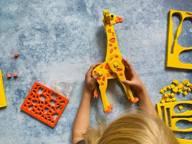 Overhead shot showing the finished giraffe and all of the unused foam pieces