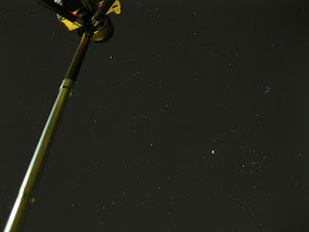 photo looking up below tripod at stars