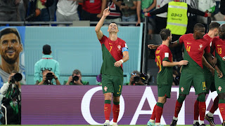 Cristiano Ronaldo celebrates with teammates after opening scoring for Portugal from the penalty spot in their FIFA World Cup 2022 opener match against Ghana at the Stadium 974 in Doha, Qatar