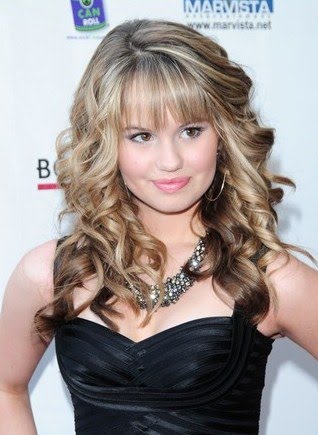 Debby Ryan cuddles close to puppy Presley on the pink carpet premiere of 16