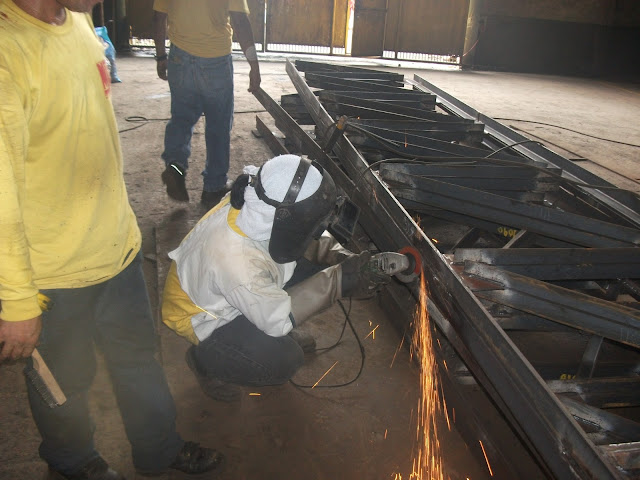 Steel Fabricator grinding welding joints