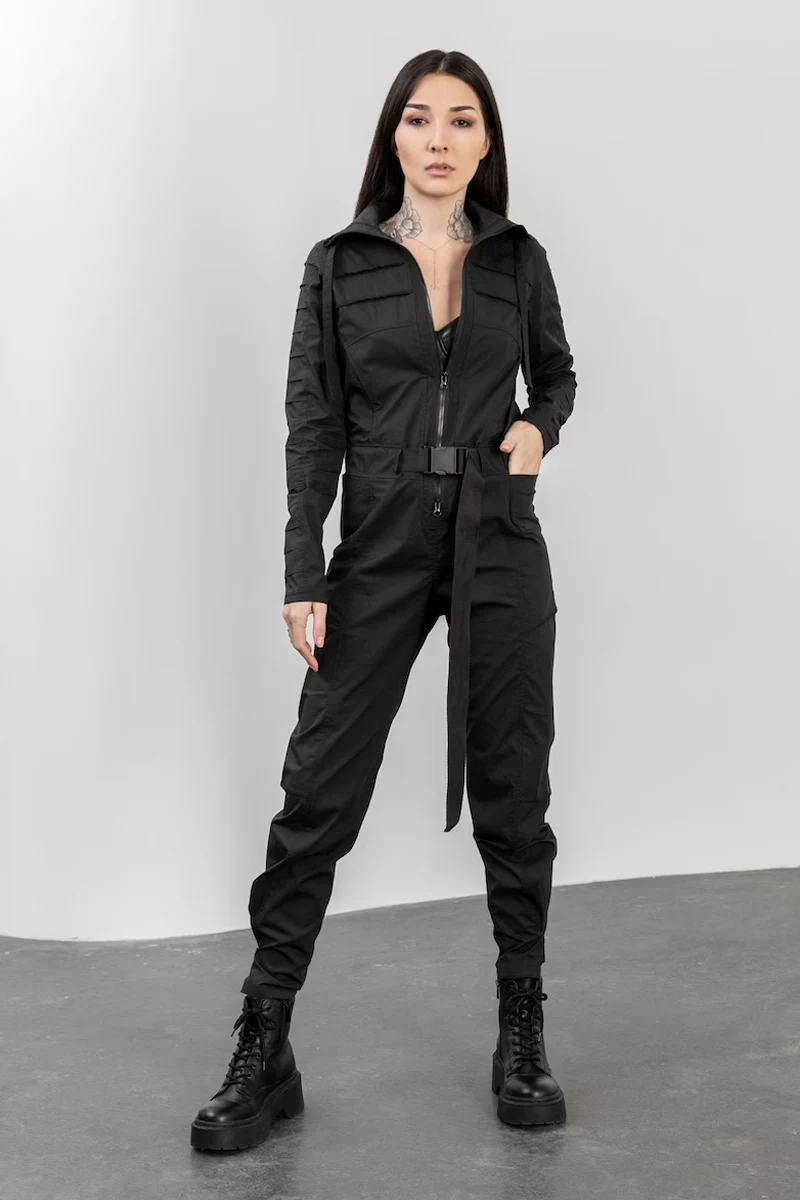 woman in a stylish total black look wearing jumpsuit