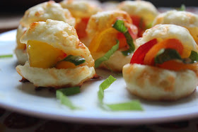 Mini profiteroles with tomatoes and basil