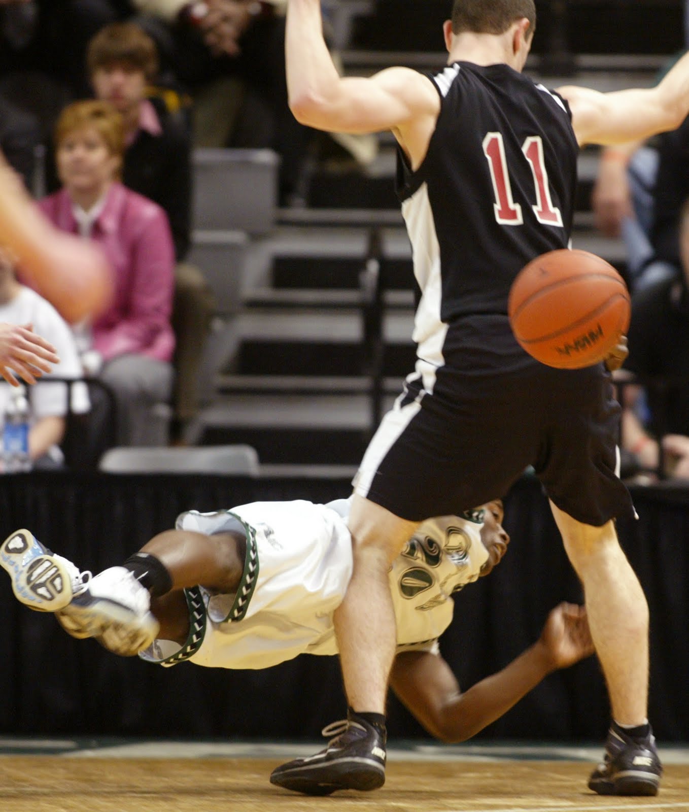 victory high ball bobber  the ball around Marine City Cardinal Mooney's Joe Broderick, top