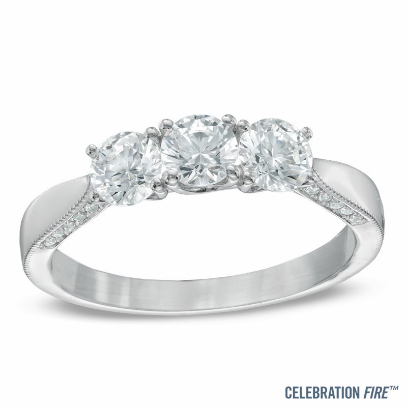 Magnificent Three Stone Engagement ring! Accent diamonds are set into ...