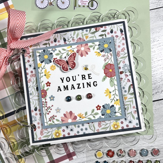 Spring scrapbook with flowers, butterflies, & a scalloped acrylic album