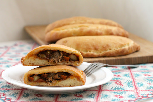 Food Lust People Love: Spicy Beef Curry Calzones feature a thick rich beef curry inside and a soft naan bread outside. They are like eating your curry by scooping it up with naan, but in a less messy, more portable way.