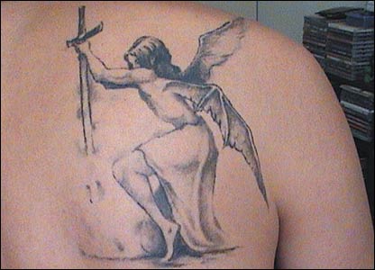 Angel Tattoo Sticking a Sword On this occasion we see a gray tattoo of an 