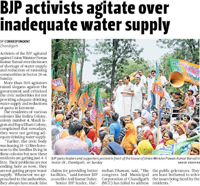 BJP party leaders Satya Pal Jain, Harmohan Dhawan and supporters protest in front of the house of Union Minister Pawan Kumar Bansal in Sector 28, Chandigarh, on Sunday.