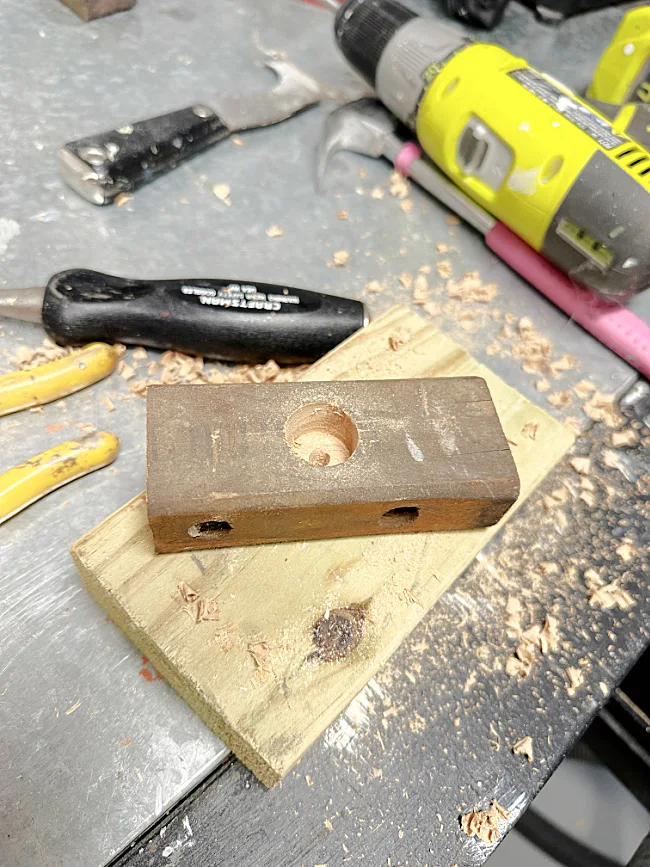drill and hole in small piece of wood