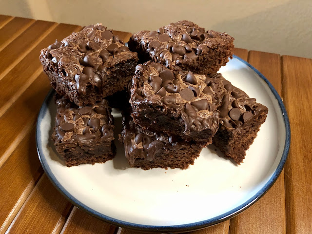 Fudgy, thick brownies with a layer of melted chocolate on top