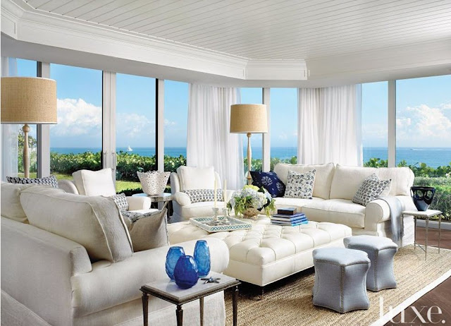 beach house with windows all walls design white tufted ottoman blue stools