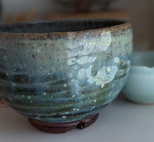blue-green glazed ceramic cup