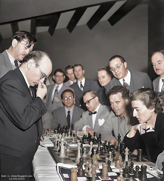 Herman Steiner (standing) observes Jacqueline Piatigorsky's moves in one of the exhibition simuls of Samuel Reshevsky given in Los Angeles, California.