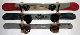 wall-mounted rack for three snowboards