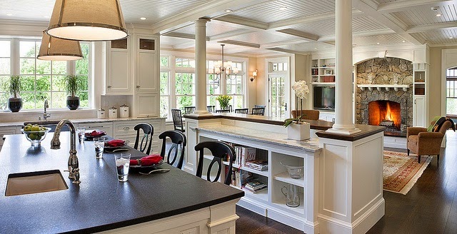 traditional beautiful white kitchen with dark hardwood floors black soapstone counter pendant lights