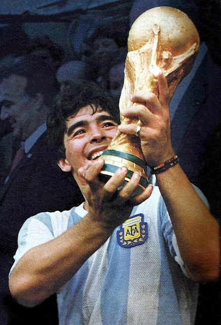 Diego Maradona holding the FIFA World Cup trophy after winning the final to West Germany.