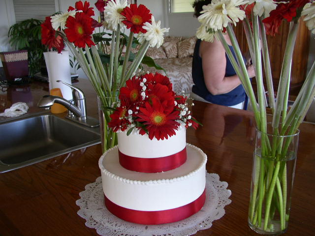 This wedding was so fun Tons of red gerbera daisies everywhere