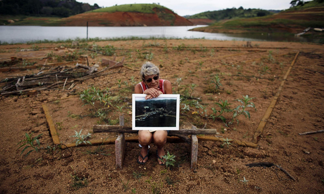 A former resident of the re-emerging old city of the Igarata. The ruins of a sunken town which had remained underwater since 1969 have re-emerged, as parts of Brazil grapple with the country's worst drought in 80 years. Photo: Nacho Doce / Reuters