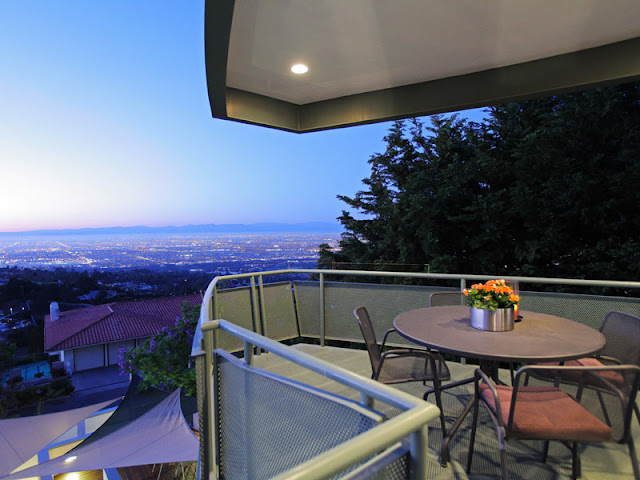 Photo of Los Angeles as seen from the small balcony with round table