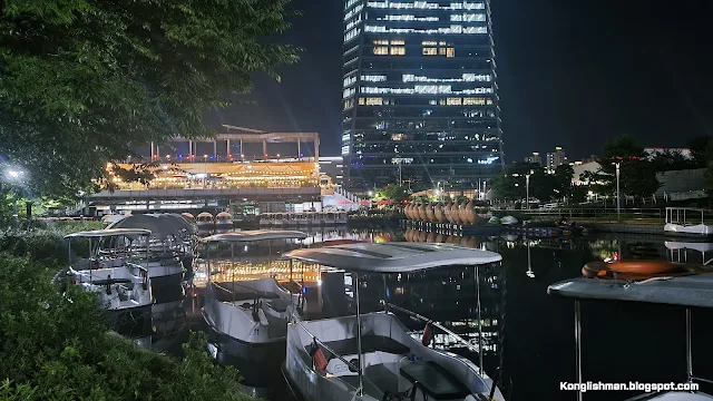 A night view of the pedal boat dock in Songdo Central Park. The moored ships and the POSCO Tower seen behind them.
