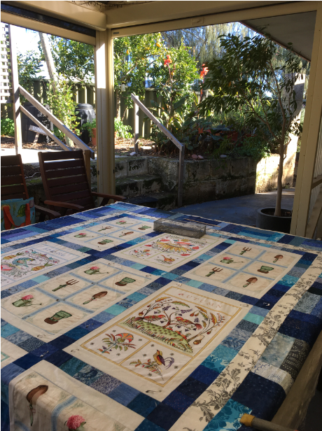 Pinning a quilt on an outside table