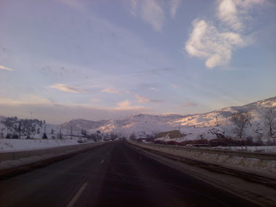 picture of highway and mountains, looking out of a car