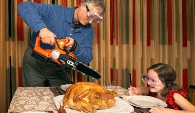 man cutting turkey with a chain saw