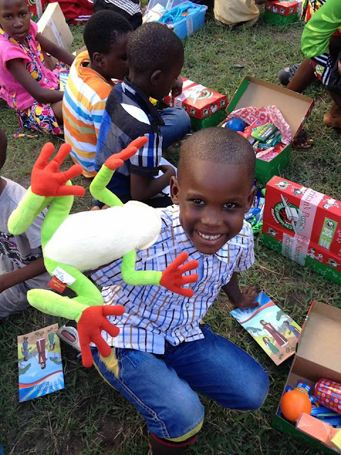 Operation Christmas Child boy with stuffed frog