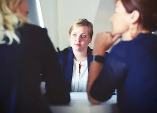 woman at desk during business meeting