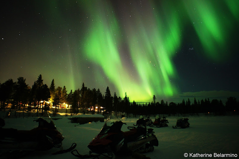 Snowmobiles Under Northern Lights Outdoor Winter Activities in Sweden's Lapland