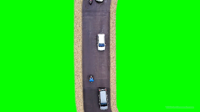 An aerial view of a road with cars and motorcycle with green background.