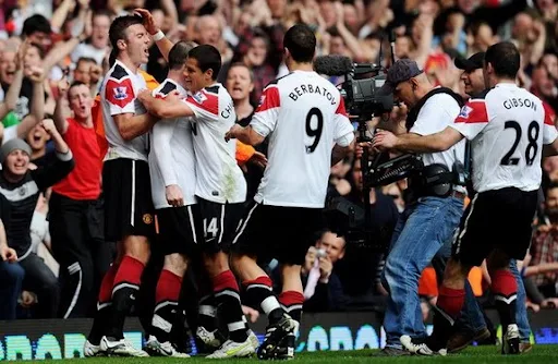 Wayne Rooney swears down the camera after completing his hat-trick