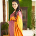 Beautiful Girln in Yellow Silk Saree with a Purple Blouse