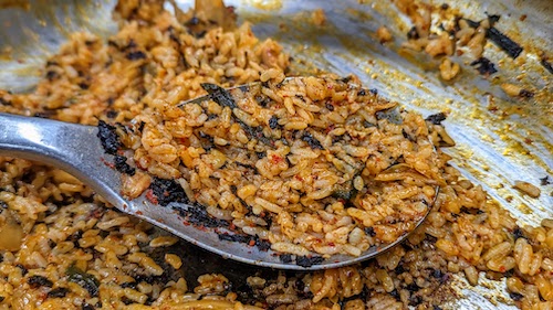 Fried rice starting to be mixed with stew and kimchi