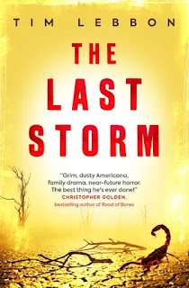 Book The Last Storm by Tim Lebbon. Against a brown-yellow background, the skeletal outlines of dead trees rise over a parched, cracked which is shining with rain. Among scattered twigs and detritus, a scorpion raises its sting.