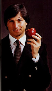 Young Steve Jobs holding an apple