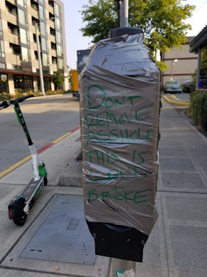 taped up walk sign