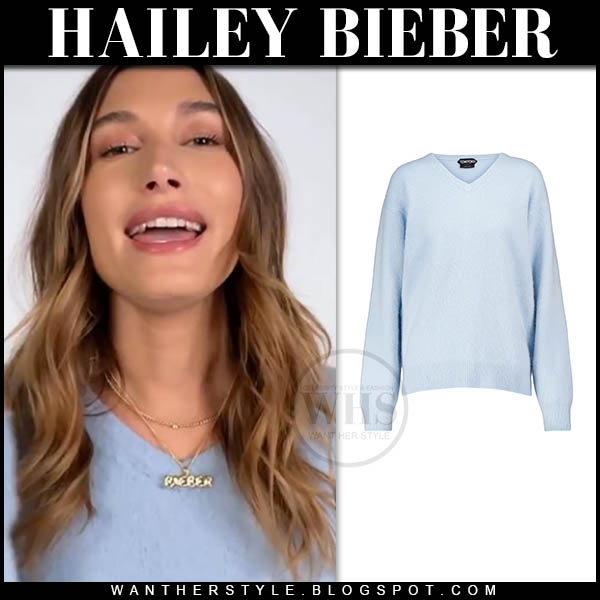 Hailey Bieber in light blue cashmere sweater and hoop earrings
