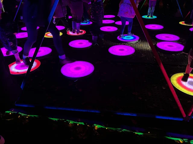 Round coloured lights being stepped on my children in the dark