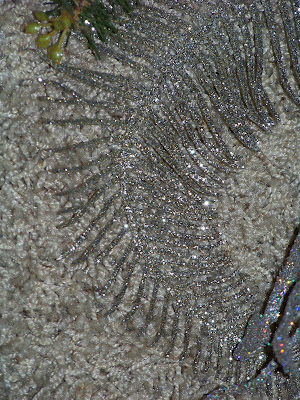 also use one long silver glittery fern leaf.