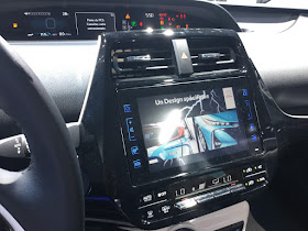 Pic on computer alongside stearing wheel inside Toyota Prius