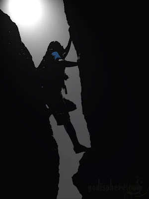 Silhouette of Man rock climbing on mountain ridge