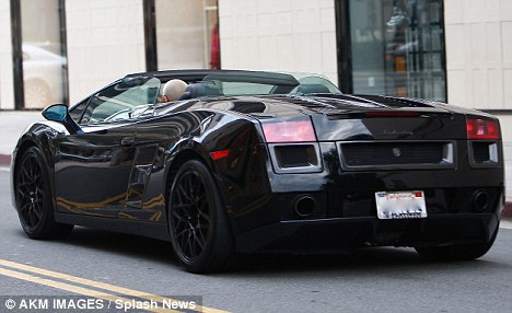 in New York on Monday in a black Lamborghini Gallardo is very expensive