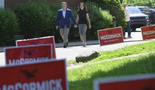 Republican Senatorial Candidate David McCormick and his wife Dina Powell McCormick head to vote at his polling location on the campus of Chatham University in Pittsburgh, Pa