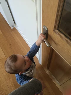 toddler baby opening door