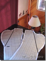 Front jacket lapels with hair canvas basted to the fashion fabric with the 1/4" tape basted to the roll line.
