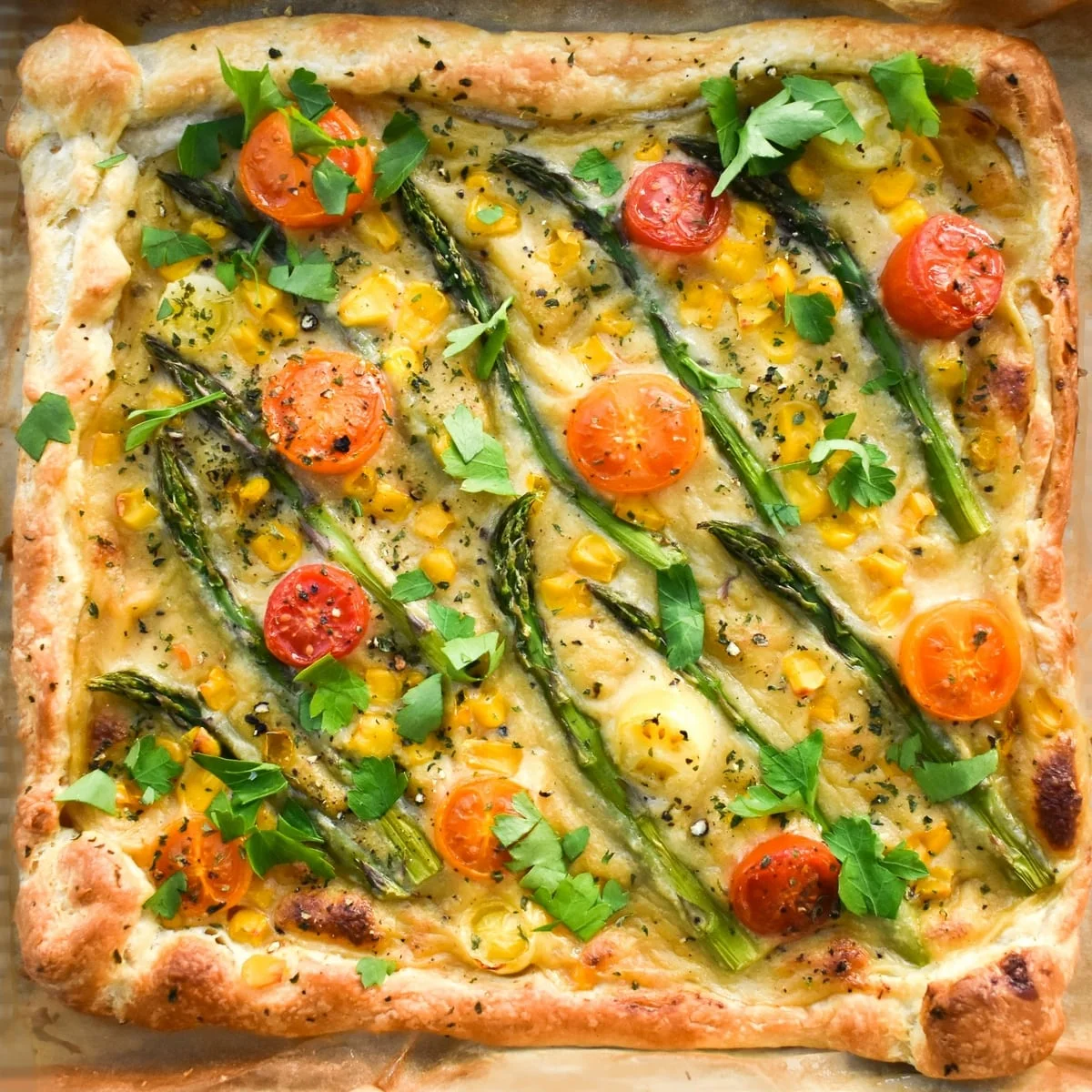 Summer vegan tart with asparagus, tomatoes & corn